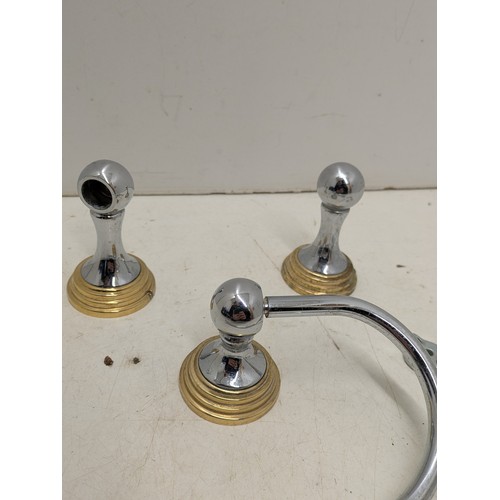 2095 - A Stainless Steel And Brass Designer Toilet Roll Holder