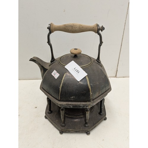 1071 - An Octagonal Based Teapot With Stand and internal Oil Heater