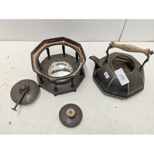 1071 - An Octagonal Based Teapot With Stand and internal Oil Heater