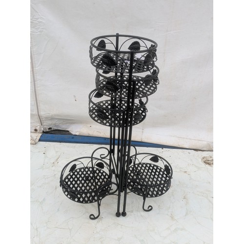 266 - A Collapsible metal flower pot stand with floral features