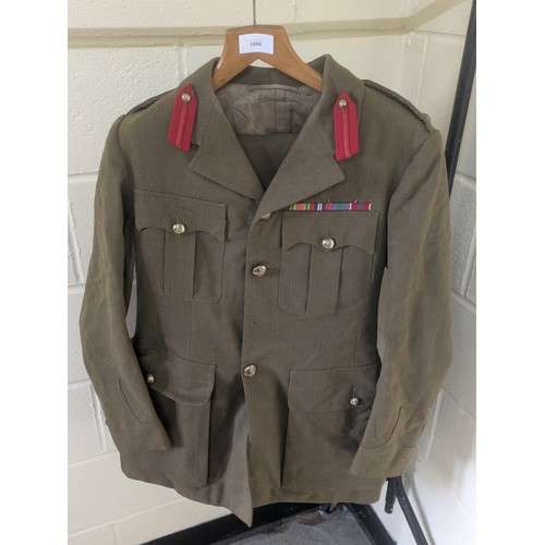 1068 - A Circa WW2 British Army Uniform With A Selection of Various Medals and Badges