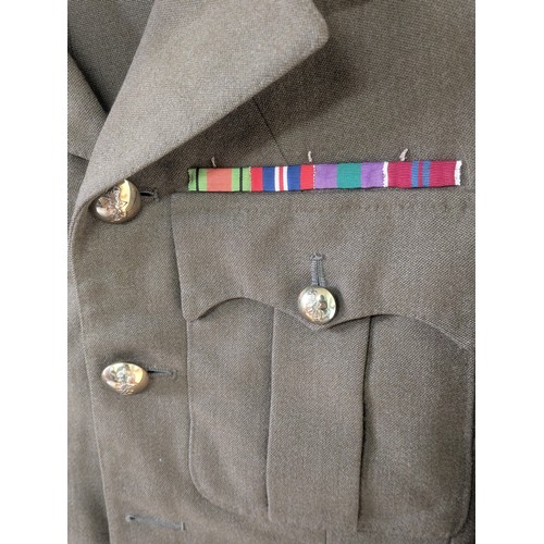 1068 - A Circa WW2 British Army Uniform With A Selection of Various Medals and Badges