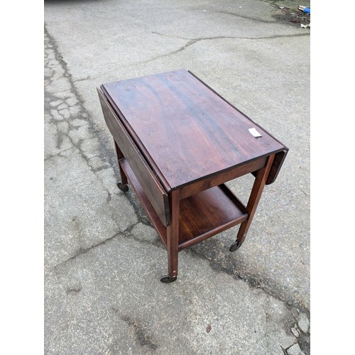 404 - A British made Pine drop leaf table on casters - plaque underneath for E&S Quality British Made