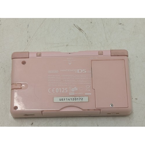 1516 - A pink Nintendo DS Console With Charger and 4 Games - Working