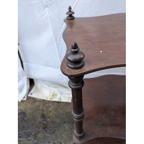 490 - A antique mahogany wotnot with brass casters