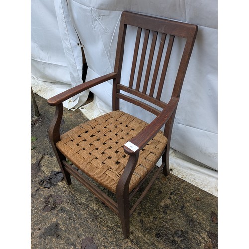 463 - A wicker based oak fireside chair