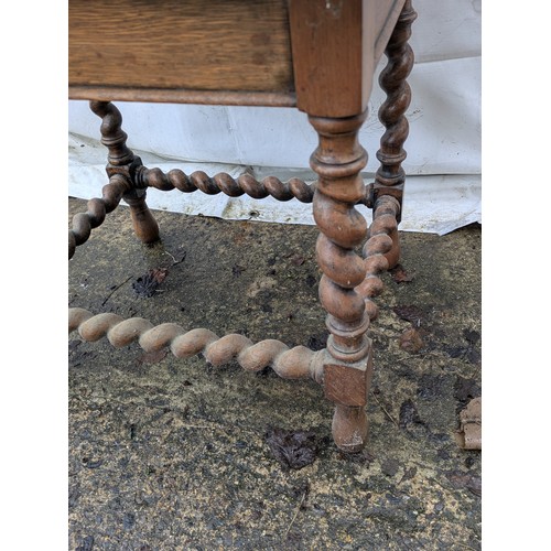 496 - A late 19th century oak table with barley twist legs