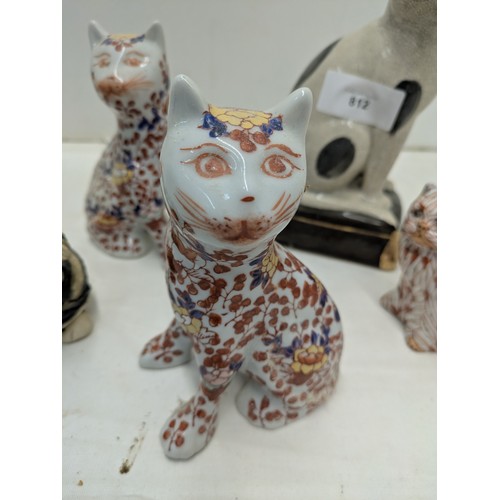 812 - A Selection of ceramic cat figures including a pair of oriental Florally patterned pieces