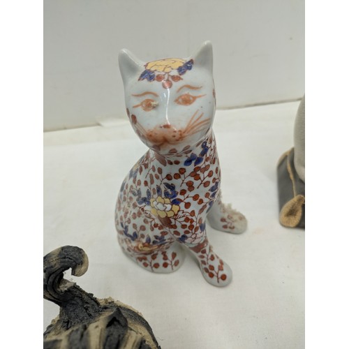 812 - A Selection of ceramic cat figures including a pair of oriental Florally patterned pieces