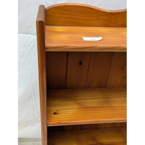 516 - A stained pine bookcase with 4 shelves