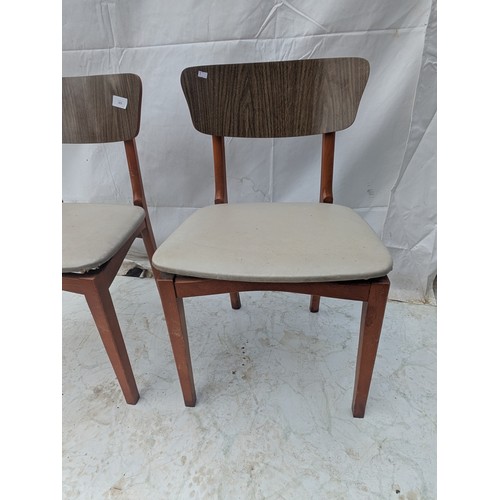 470 - A pair of mid century chairs with upholstery bases