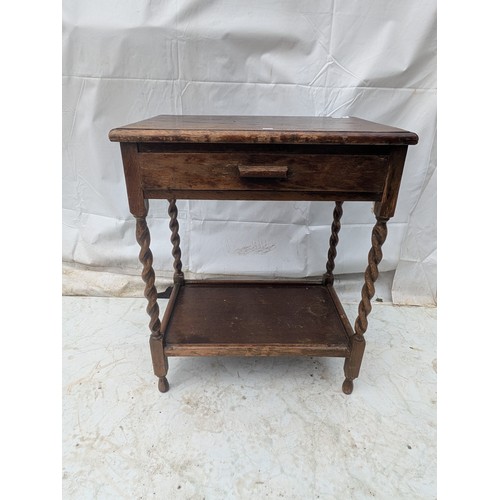 480 - An oak side table with 1 drawer and barley twist legs