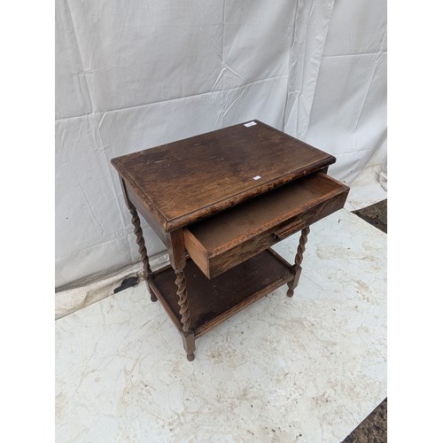 480 - An oak side table with 1 drawer and barley twist legs