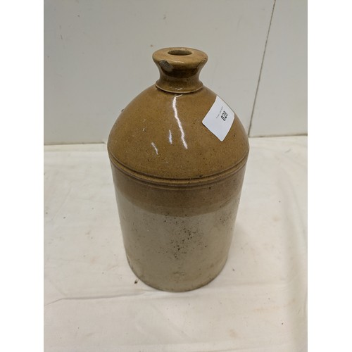 828 - An antique stoneware jug with markings for W M Barker & Son Bishopsgate London