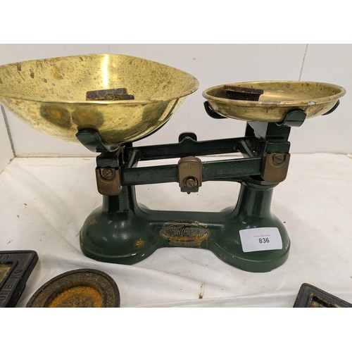 836 - A vintage 'the viking' weighing scales with a selection of brass and cast iron weights