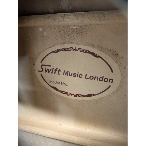 1813 - A Swift music London acoustic guitar in soft carry case