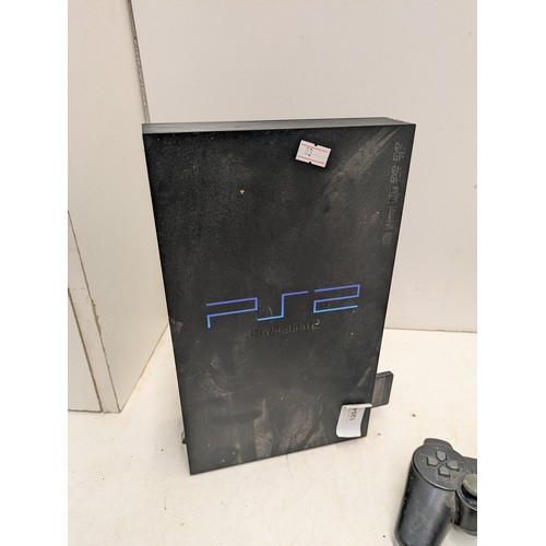 1204 - A Sony Playstation 2 console with cables and 2 controllers