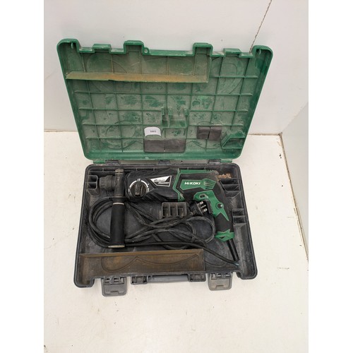 1603 - A Hitachi Hikoki model dh 26px corded rotary hammer in case