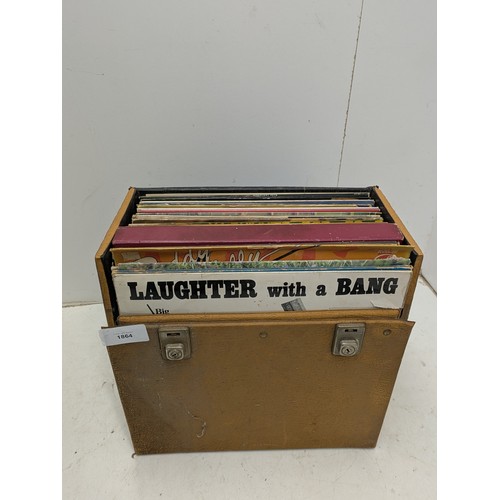 1864 - A large collection of vinyl records In a leather case