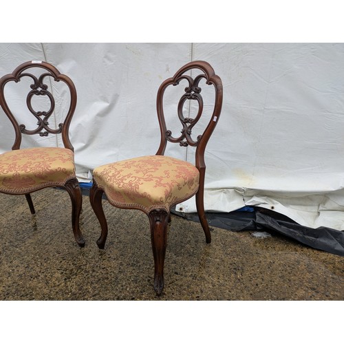 450 - A pair of mid 19th century mahogany dining chairs with a red and cream floral upholstered base and a... 