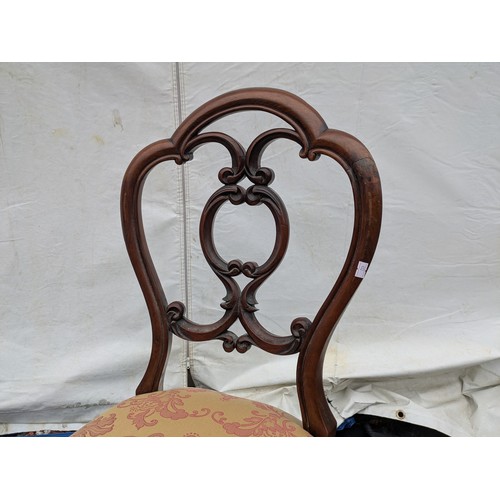 450 - A pair of mid 19th century mahogany dining chairs with a red and cream floral upholstered base and a... 