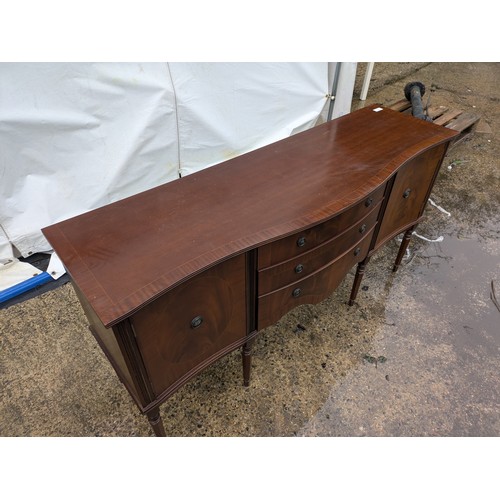 425 - A nice mahogany verniered side table with 3 drawers and 2 cupboard spaces