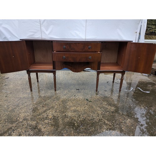 425 - A nice mahogany verniered side table with 3 drawers and 2 cupboard spaces