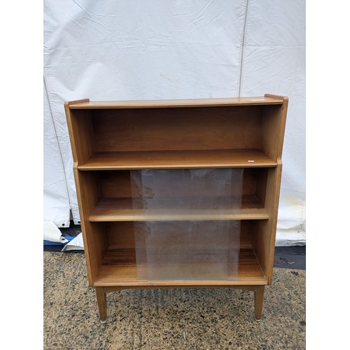 404 - A Nice mid-century Nathan 3 tier bookshelf/storage unit with glass sliding doors