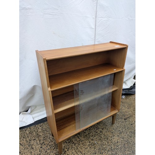 404 - A Nice mid-century Nathan 3 tier bookshelf/storage unit with glass sliding doors