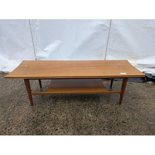 406 - A stylish mid-century coffee table with storage area underneath