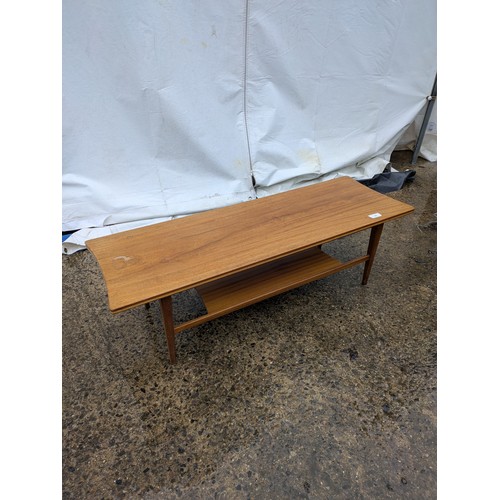 406 - A stylish mid-century coffee table with storage area underneath