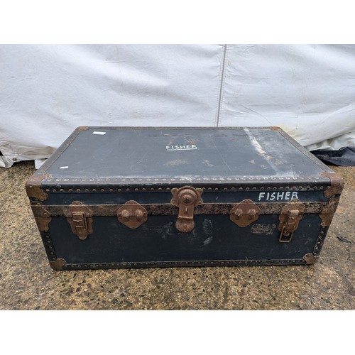 409 - A vintage canvas storage trunk with metal latches