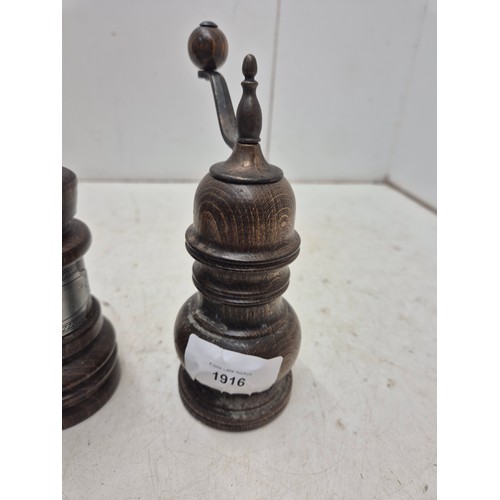 1916 - A pair of turned oak salt pot and pepper grinder