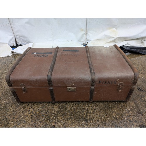 408 - A Vintage brown canvas steamer trunk with metal straps