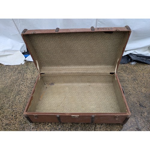 408 - A Vintage brown canvas steamer trunk with metal straps