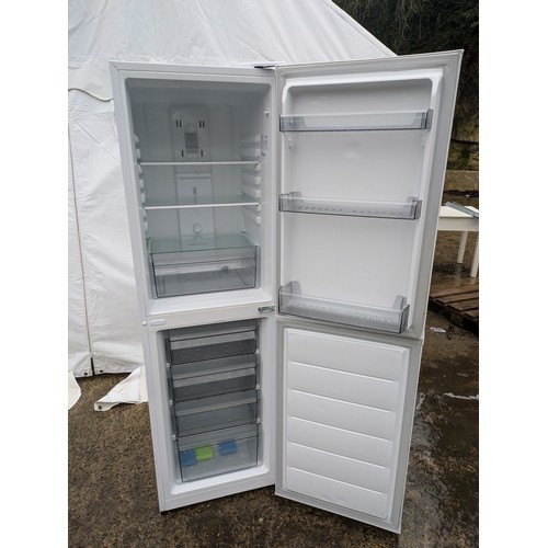 431 - A Daewoo upstanding fridge freezer in white