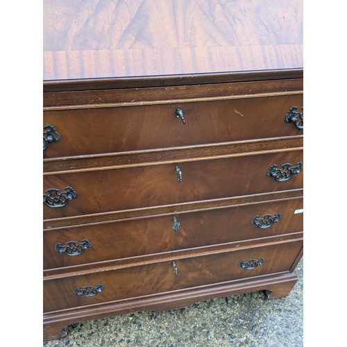 402 - An antique mahogany bureau with 2 keys and 4 drawers