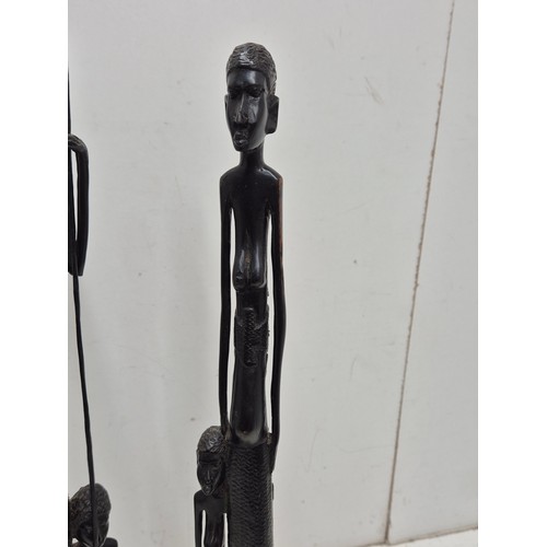 1919 - A pair of African Tribal figures in an Ebony wood