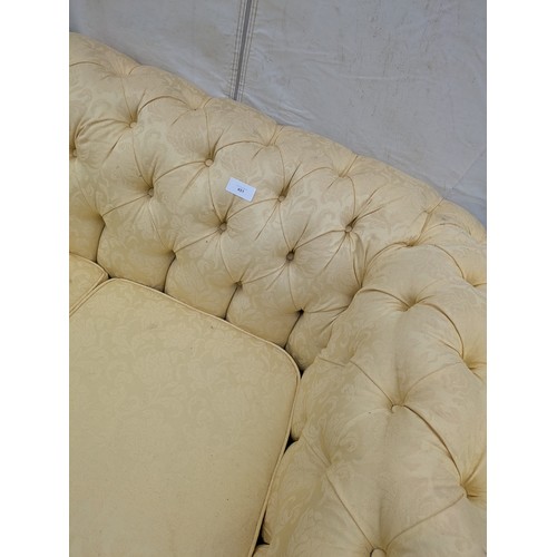 451 - A cream floral pattern upholstered 3 seat chesterfield sofa