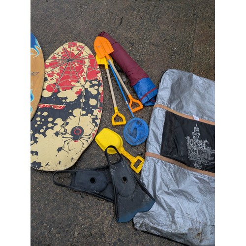 1806 - A pair of body boards and a selection of beach equipment