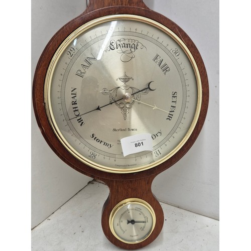 801 - A wall mounted brass clock and thermometer hygrometer