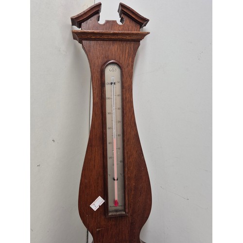 801 - A wall mounted brass clock and thermometer hygrometer