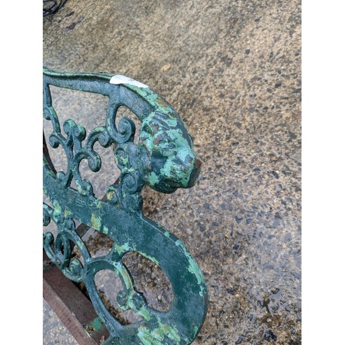 38 - A pair cast iron bench ends with lion head motifs