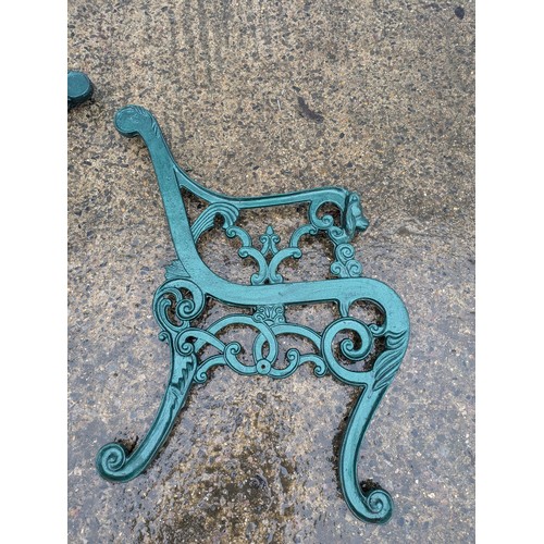 34 - A pair of cast iron bench ends with lion head motifs