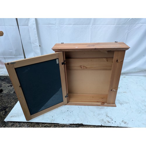 424 - A Pine wall mountable cabinet with a mirror front