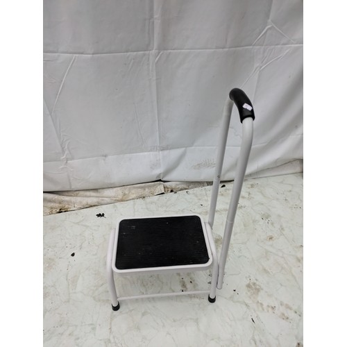 1 - A black and white metal hop-up platform