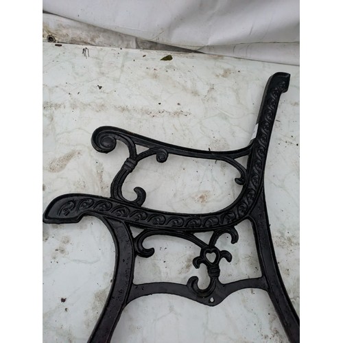 35 - A pair of cast iron bench ends