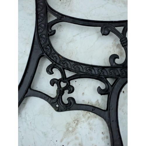 35 - A pair of cast iron bench ends