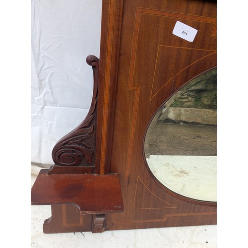 484 - A late 19th century mahogany veneered fireplace mirror with bevelled edge and walnut inlays