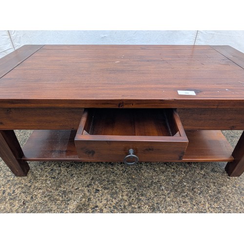 486 - A mahogany 7 plank coffee table with an underlying storage area